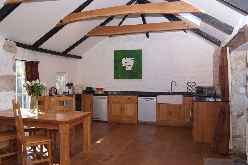 Large kitchen with flowers on the table