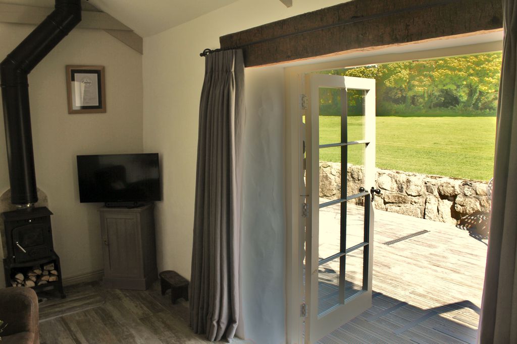 Open doors out into the patio in the sun