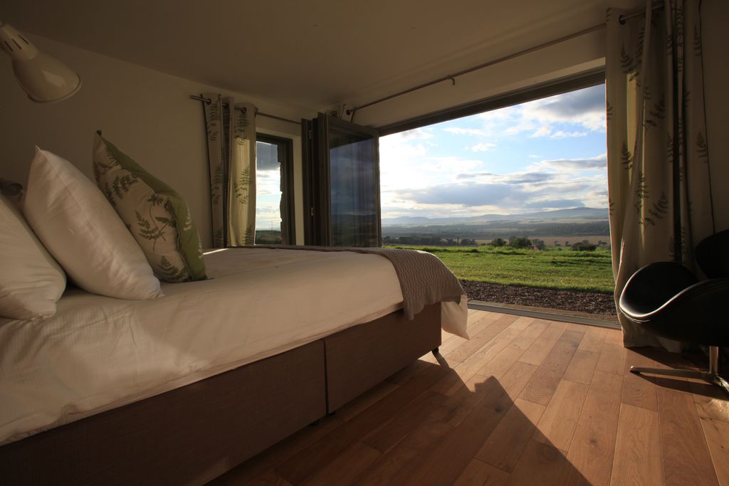 Balbinny Scotland double bedroom with bi-folding doors and stunning countryside views