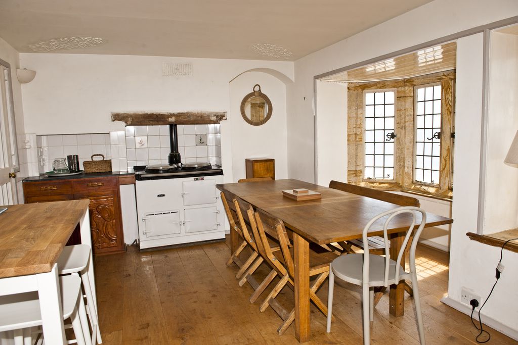 Kitchen dining area with white aga