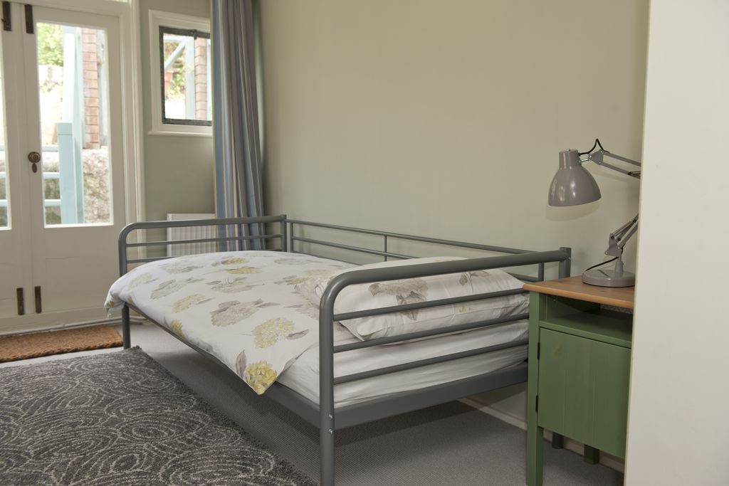 Single bed with flower style duvet at The Sundial
