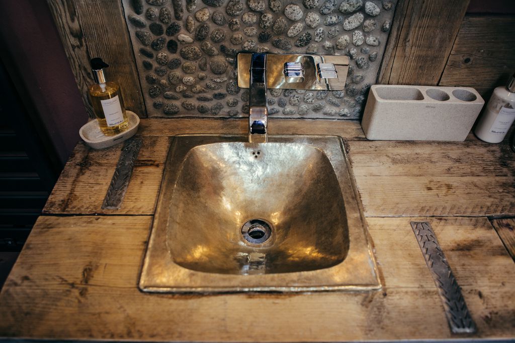 Bathroom sink on wooden cabinet