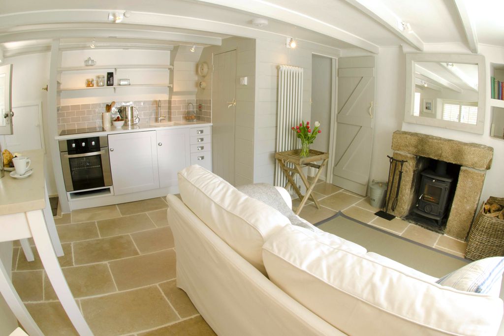 Cosy open plan living room and kitchen at Cornish Cottage in Cornwall