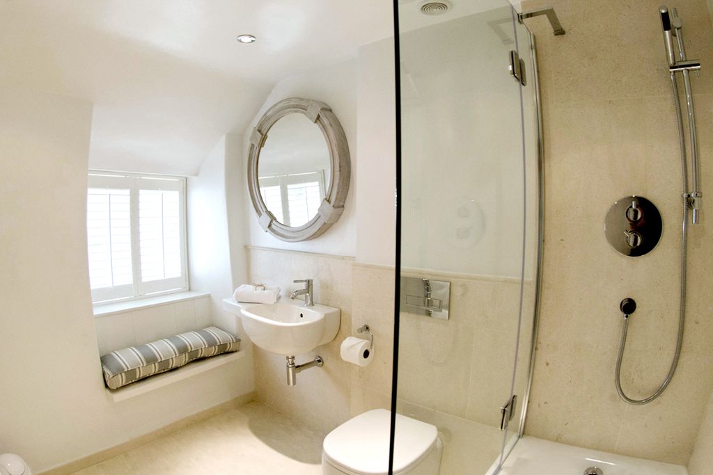 Modern bathroom with walk in shower and window seat