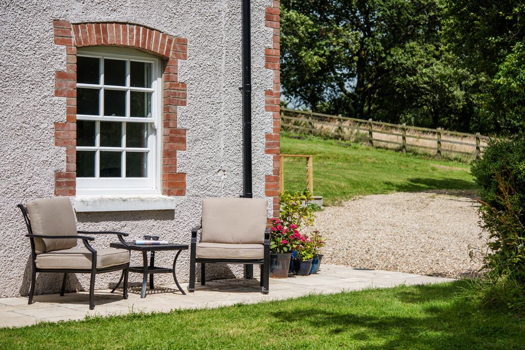View of the garden and dining set outside the cottage