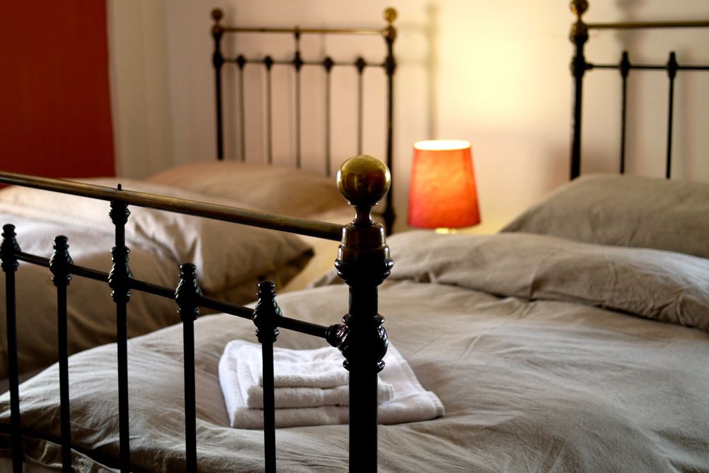 Cosy twin bedroom with wrought iron bedsteads