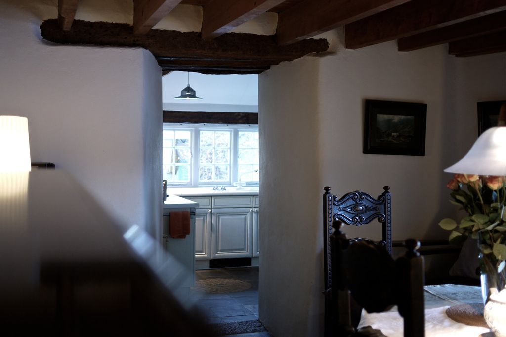 Dorrway leading from dining room to the traditional kitchen