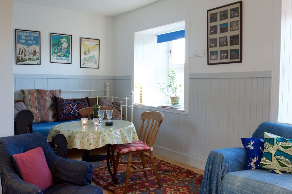 Cosy dining room with artwork on the walls