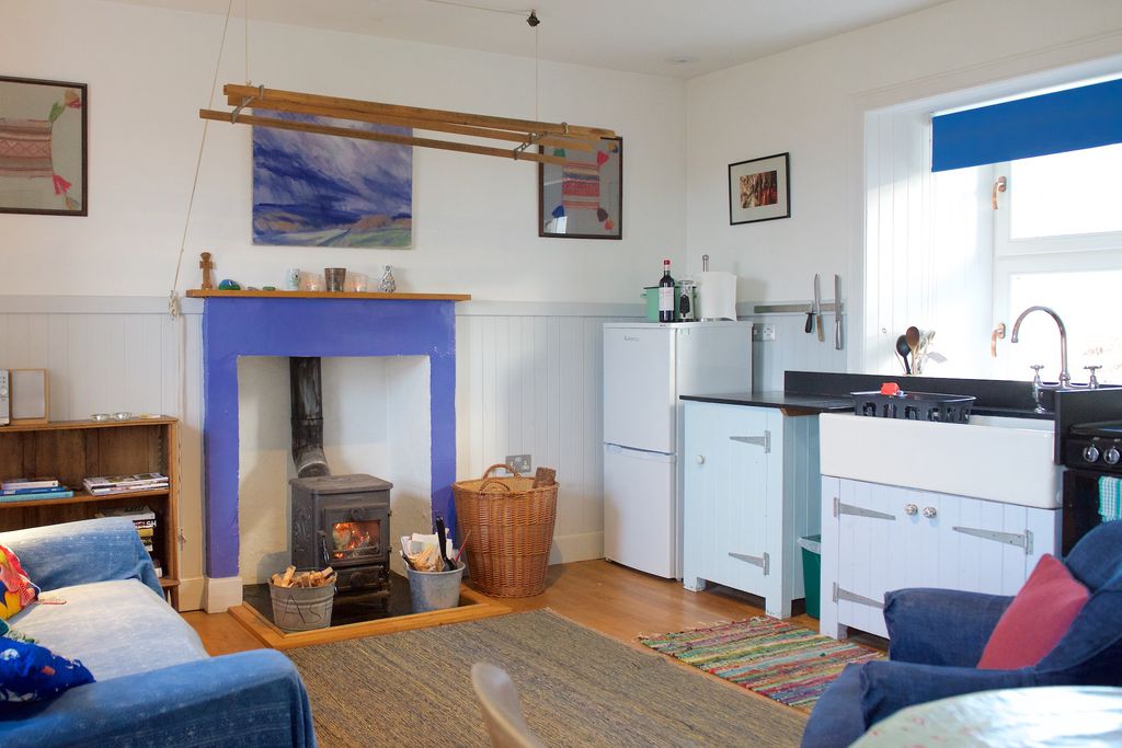 Cosy kitchen and sitting room with traditional log burner