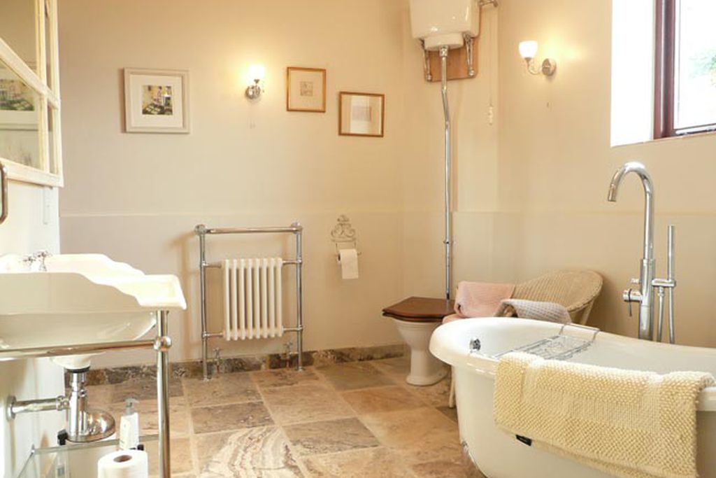 Large bathroom with free standing roll top bath