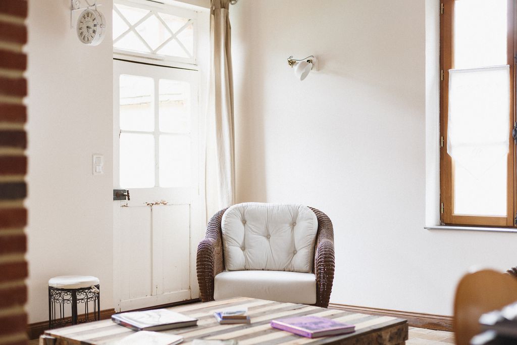 Table and comfy chair near the door for La Lévrière