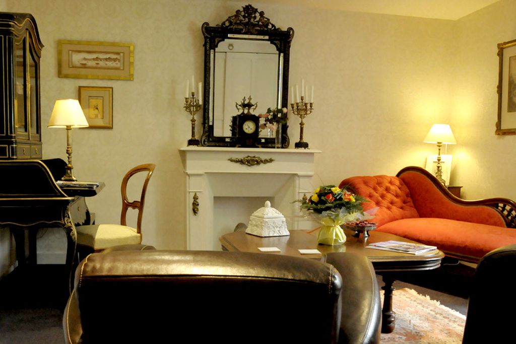 The study with desk, fireplace and chaise lounge