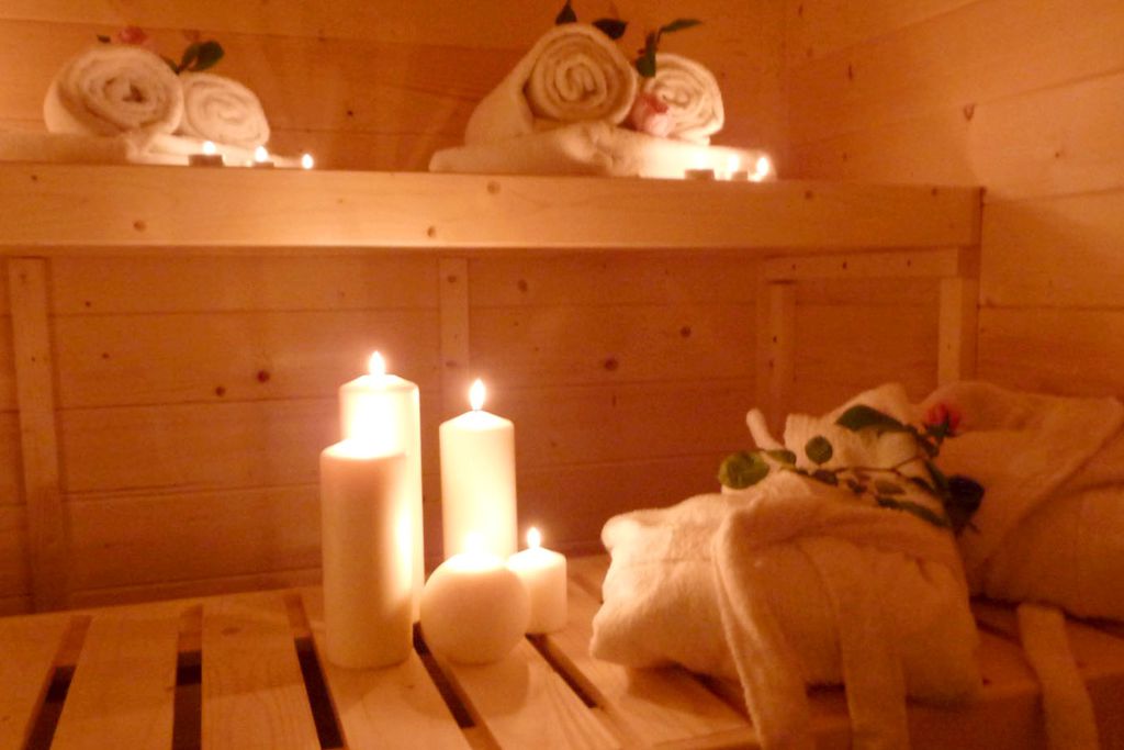 The sauna with lit candles at Domaine de Moulin Mer