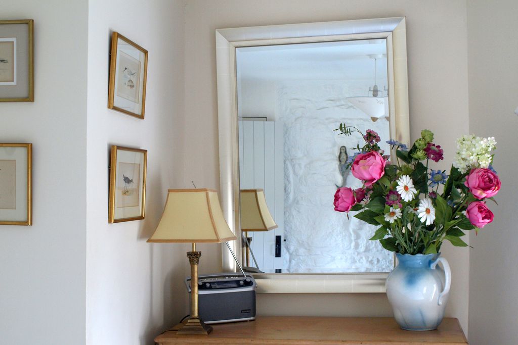 Chest of drawers with fresh flowers