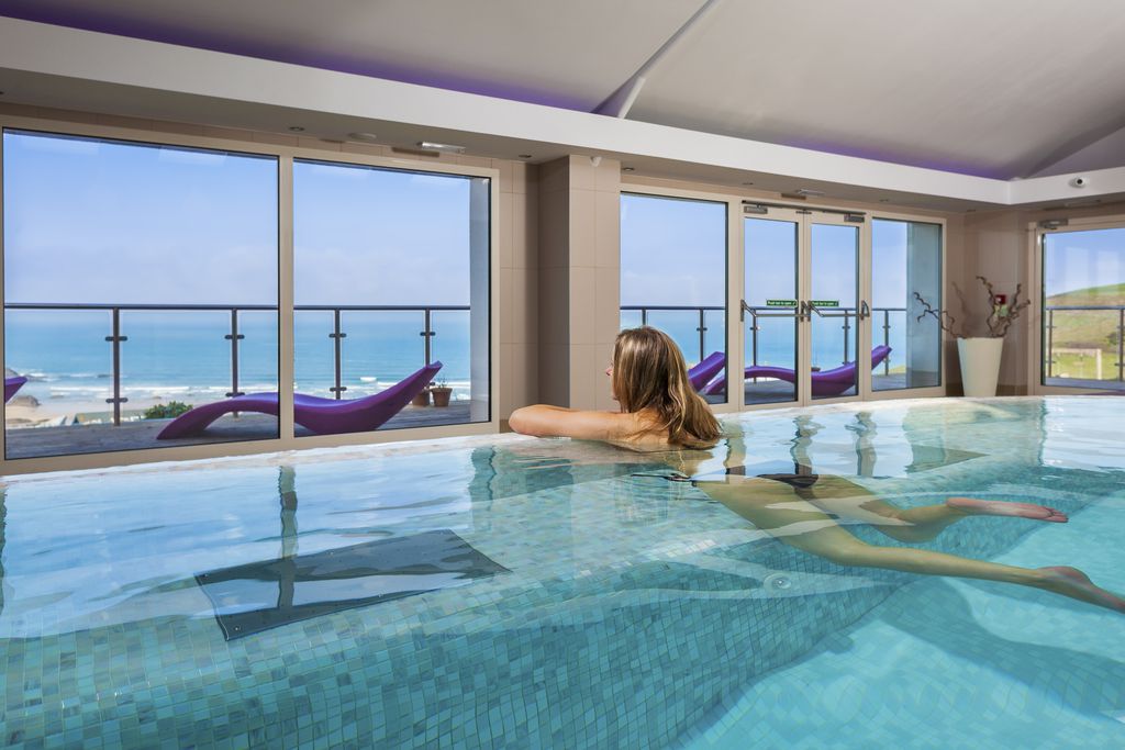 Indoor pool with views over the sea