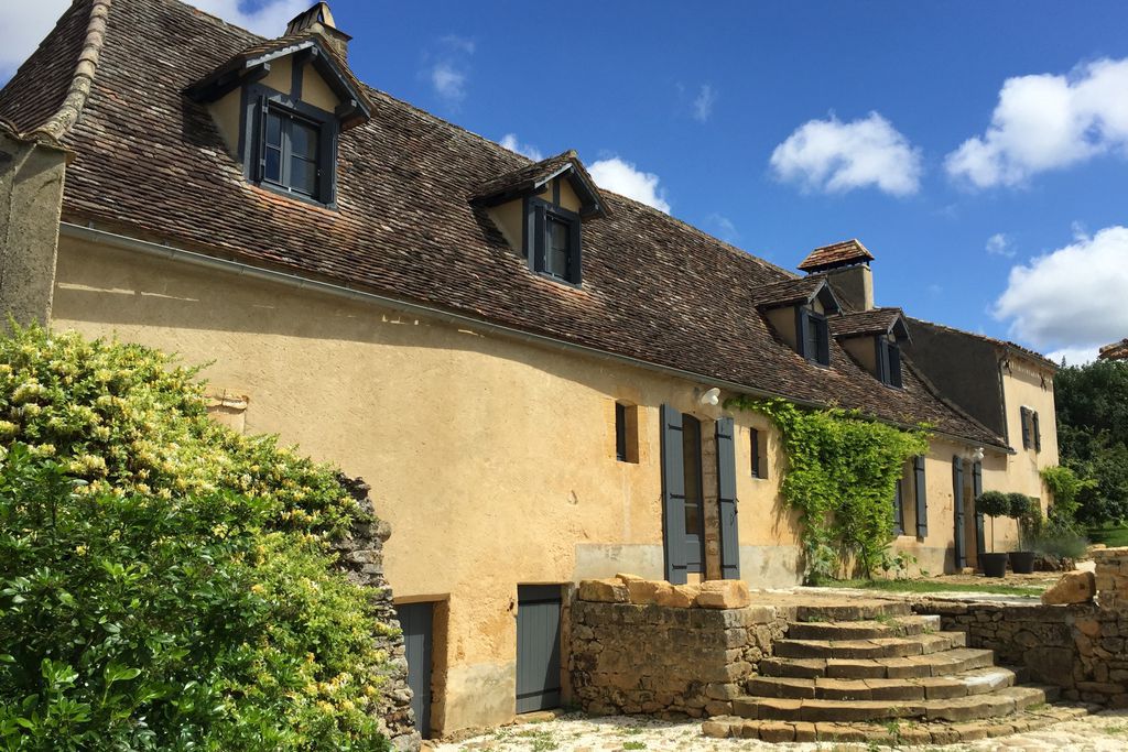 Exterior of Le Mas, with steps leading up to the property, in Dordogne, France