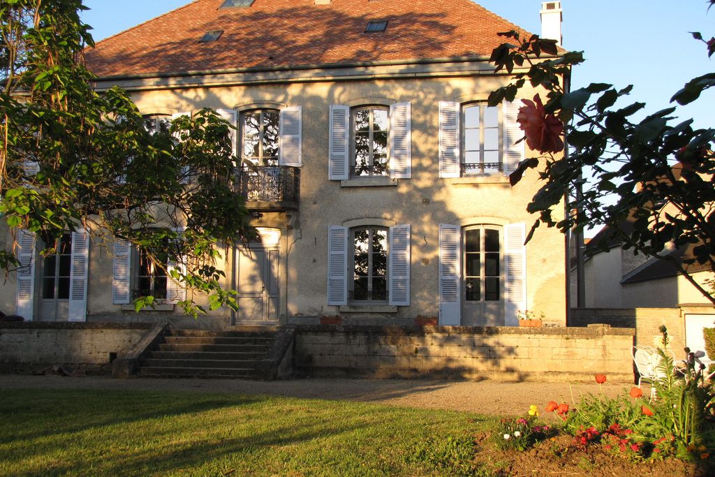 Exterior or Le Clos des Roseaux in Cote D'or, France with large garden and steps leading up to property