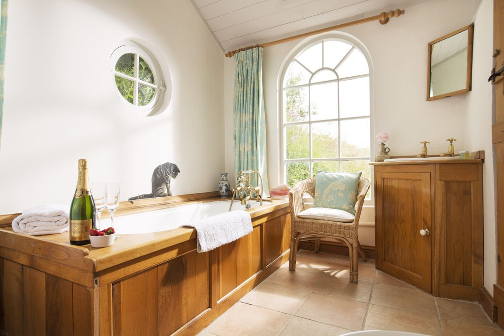 Large bathroom with traditional bath tub
