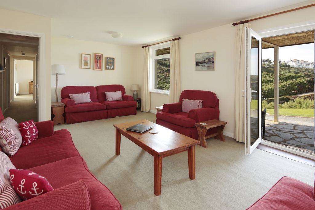 Large sitting room with door leading onto the garden