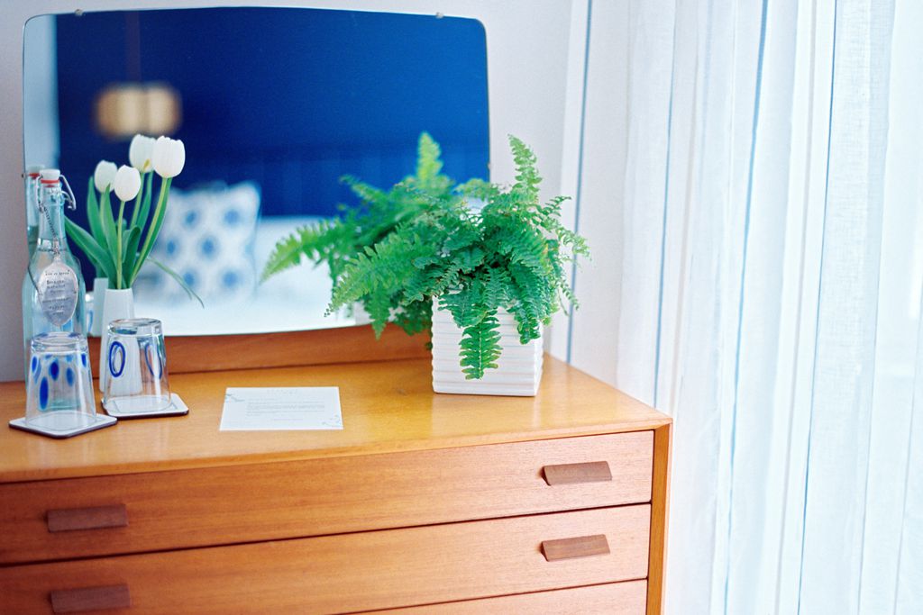 Fresh flowers on the bedroom sideboard