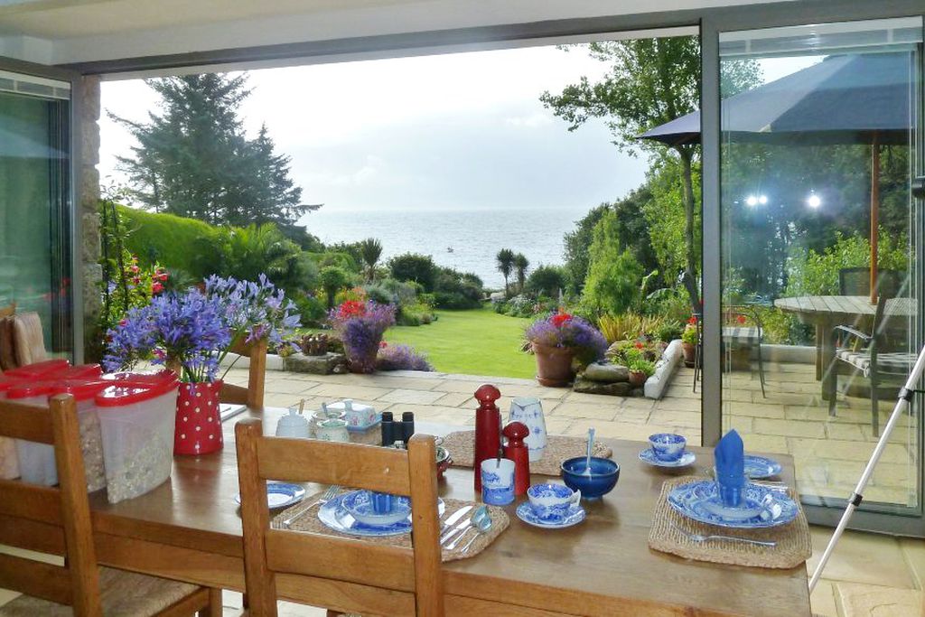 Dining table with bi folding doors leading onto the garden