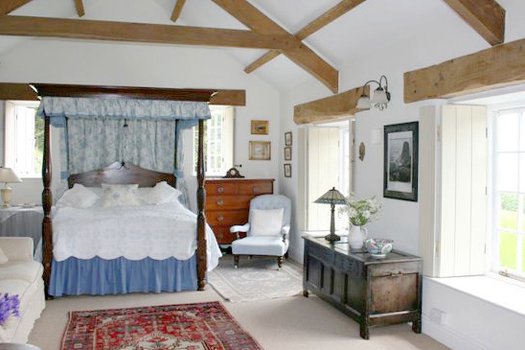 Large double bedroom with four poster bed