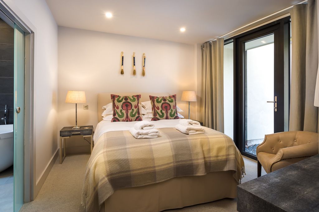 Cosy double bed in the bedroom of Rivers Edge, Riverside Terrace 