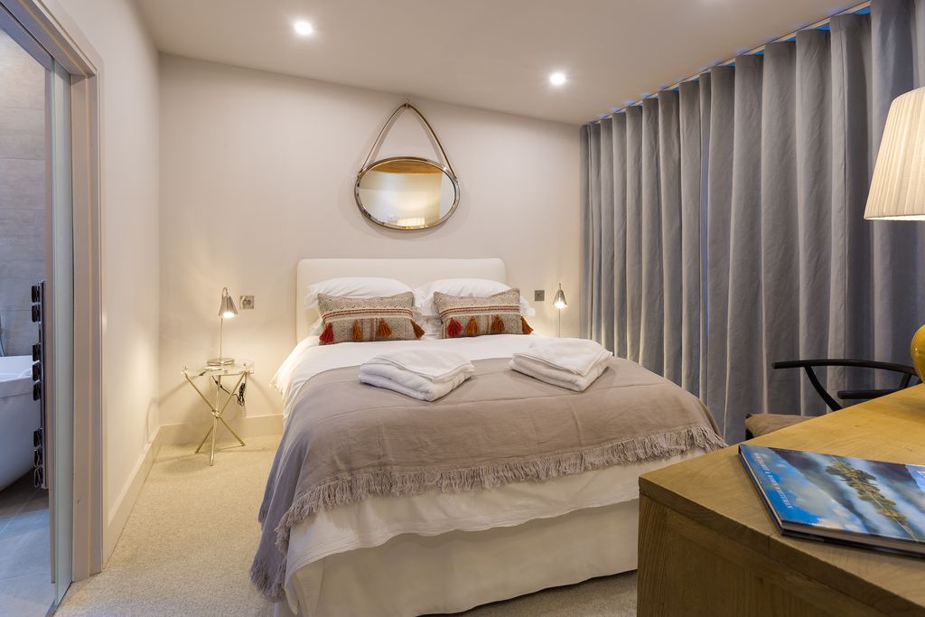 Cosy double bed in the bedroom of Waterside, Riverside Terrace