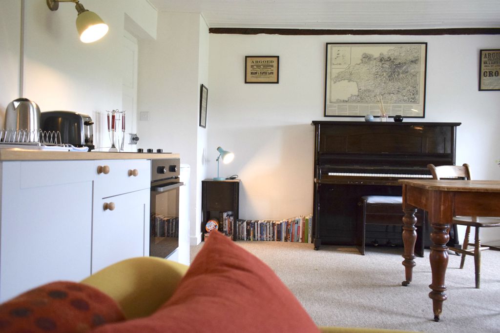 The Tudor Kitchen Farmhouse kitchen with piano