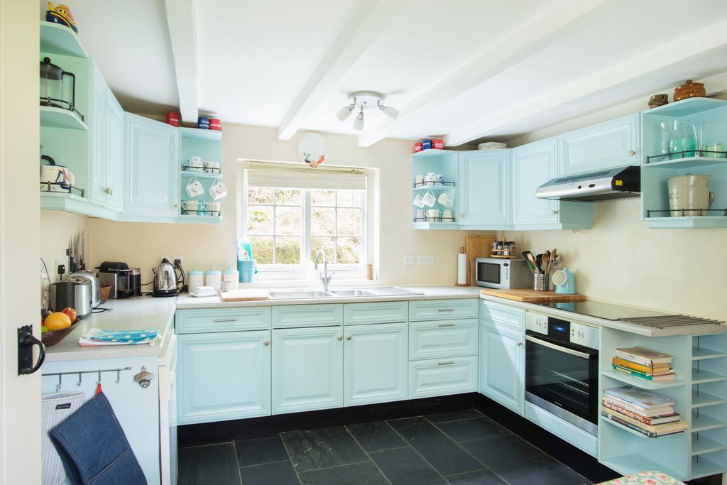 Penpoll's neat and tidy blue kitchen in Fowey Cornwall