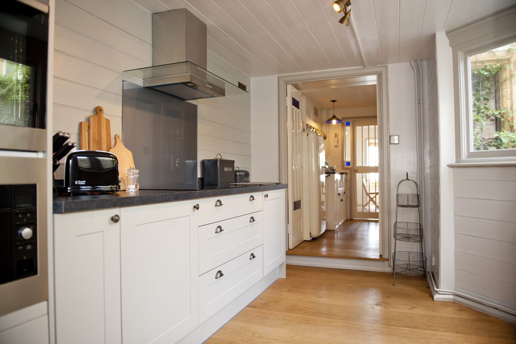 Kitchen with oven toaster and breadboards