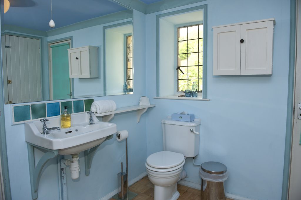 Blue and green ocean themed toilet at The Sundial