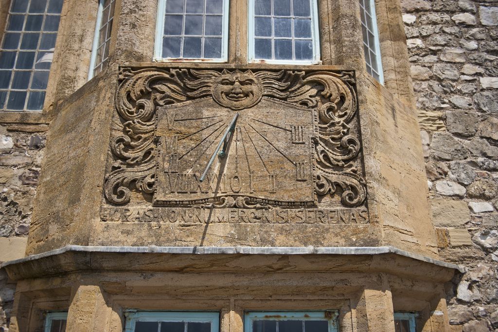 Sundial on exterior of building Lyme Regis 