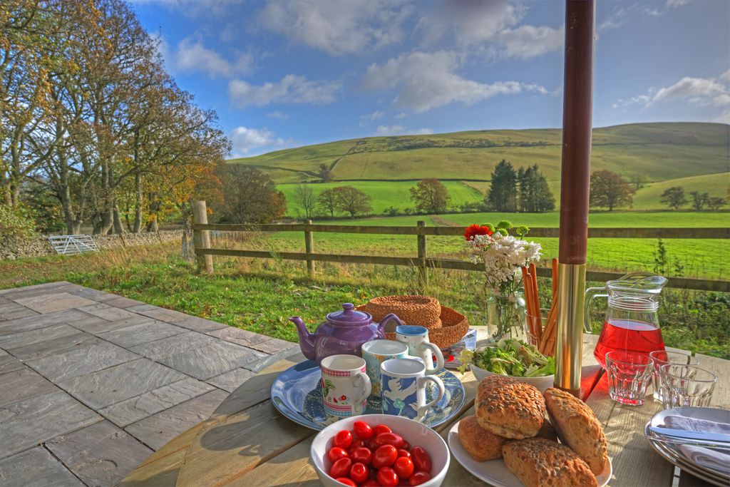 Outside table set for lunch looking out onto the breathtaking countryside