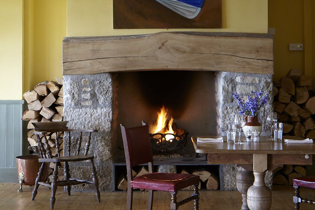 Table made up for food in front of the fireplace 