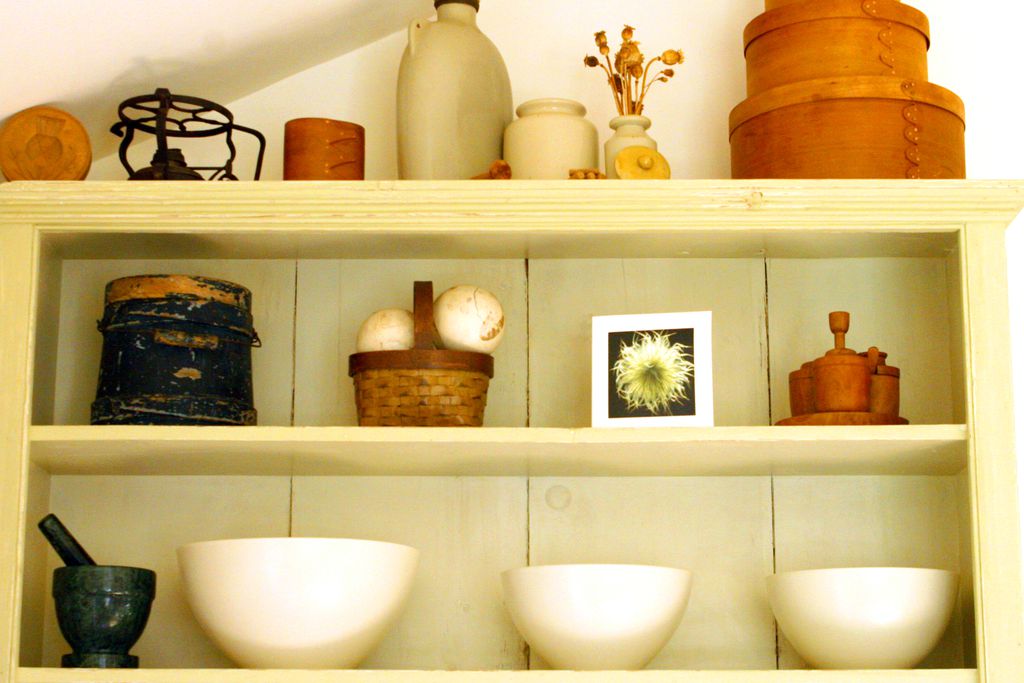 Sideboard with old cooking utensils on