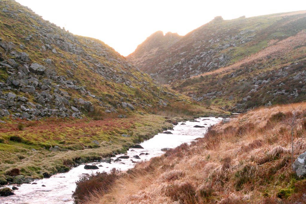 Rocky hills with small river running through the valley