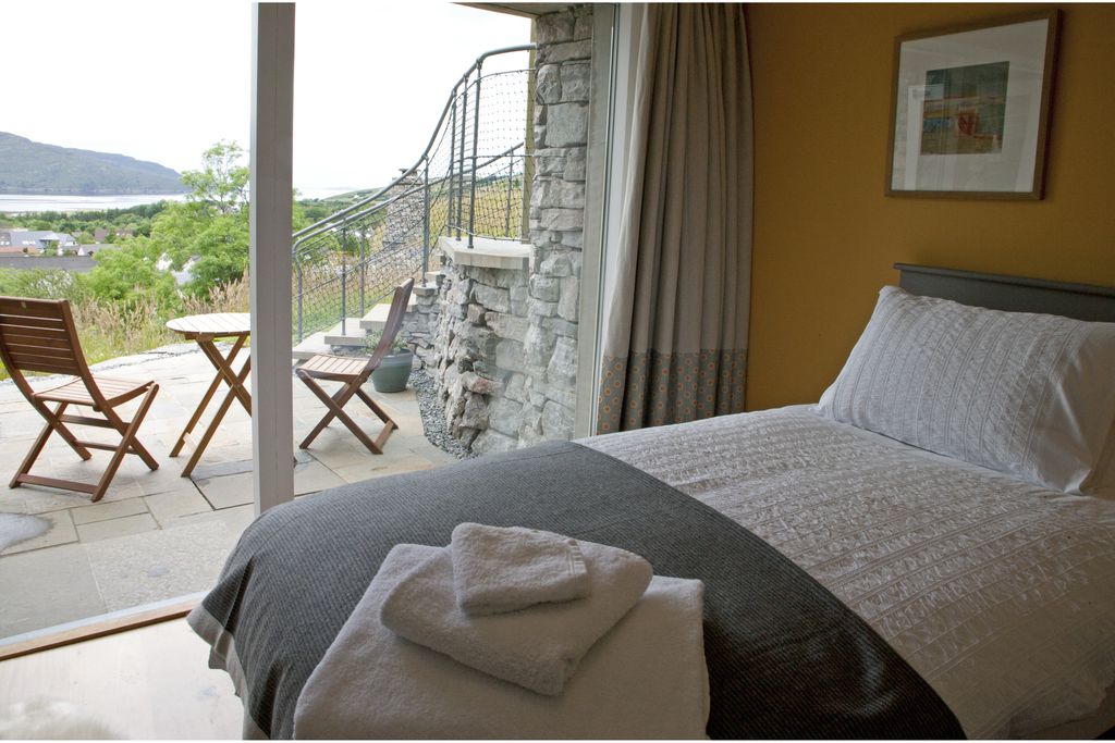 Cosy double bedroom with door leading into the garden