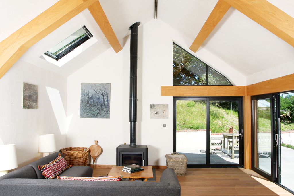 Large sitting room with log burner and bi folding doors