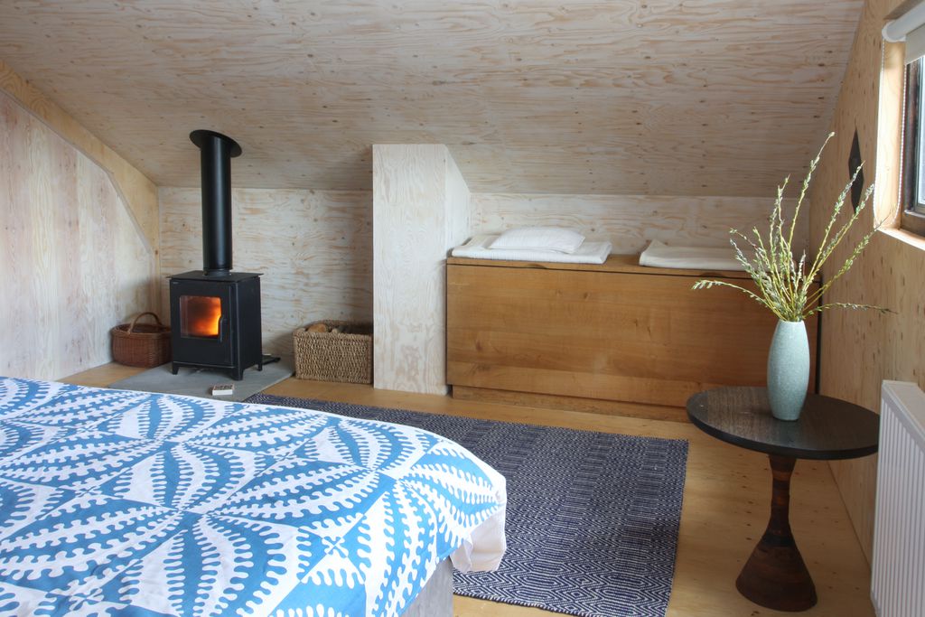 Master bedroom with log burner