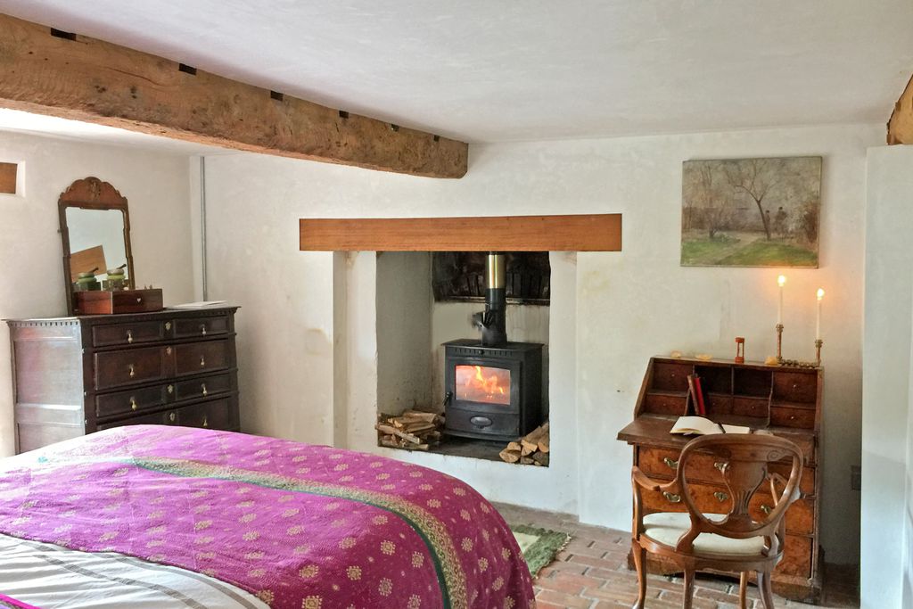 Cosy double bedroom with log burner