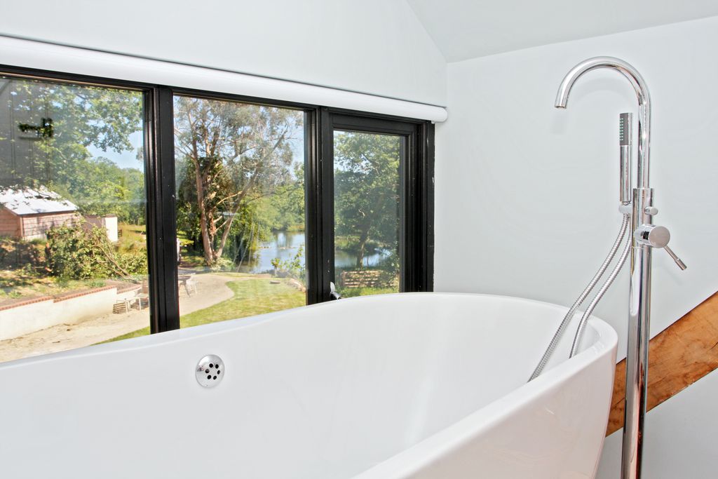 Bathroom with bath overlooking the garden