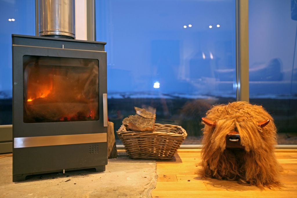 Log burner situated in the lounge with views over the countryside