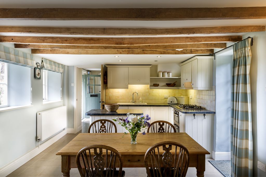 The kitchen with flowers on the table