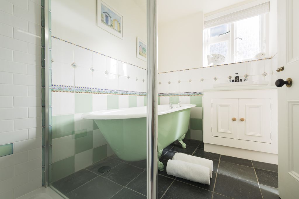 Bathroom with roll top bath tub