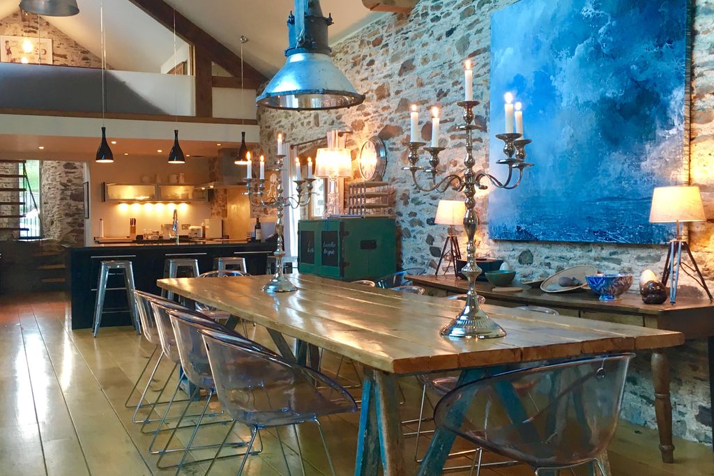 Open plan kitchen and dining area with table for 10