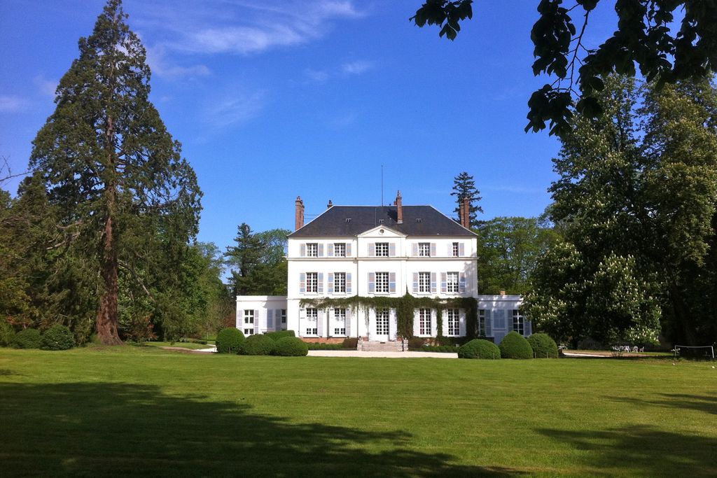 Exterior of Chateau du Bois de la Lune in Normandy, France with expansive grounds