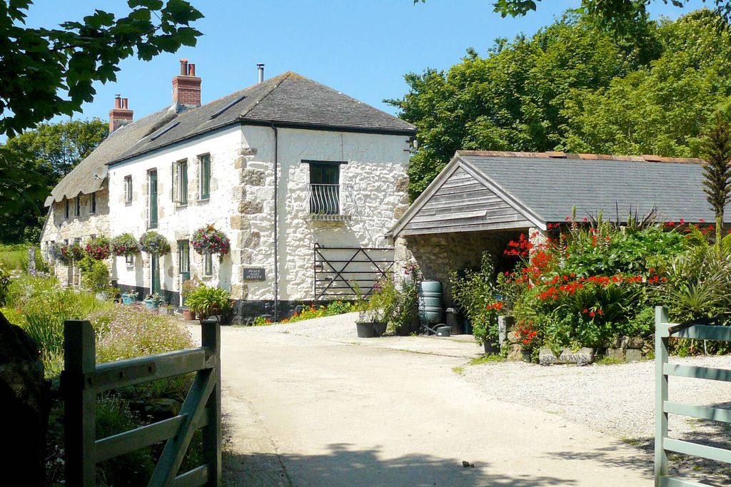 Exterior of Peace & Plenty and Ring & Thimble in Cornwall, seen through the entrance gates