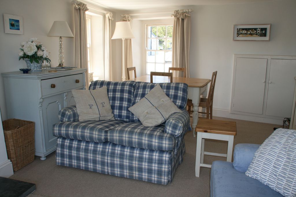 Open plan sitting room with dining table