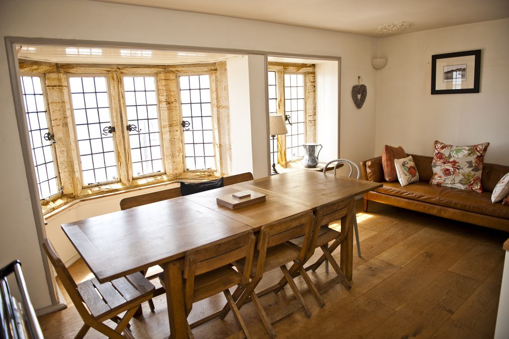 Dining room with the sun beaming through the windows